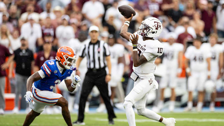 Sep 14, 2024; Gainesville, Florida, USA; Texas A&M Aggies quarterback Marcel Reed (10) throws the ball under pressure from Florida Gators defensive back Jason Marshall Jr. (3) during the first half at Ben Hill Griffin Stadium. Mandatory Credit: Matt Pendleton-Imagn Images