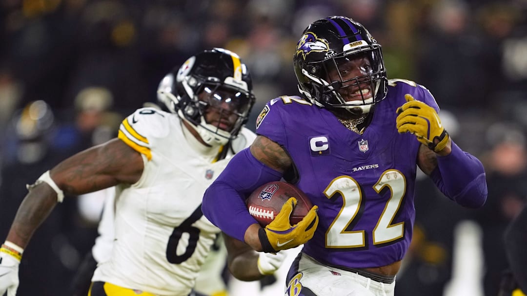 Jan 11, 2025; Baltimore, Maryland, USA; Baltimore Ravens running back Derrick Henry (22) runs to score a touchdown against the Pittsburgh Steelers in the third quarter in an AFC wild card game at M&T Bank Stadium. Mandatory Credit: Mitch Stringer-Imagn Images