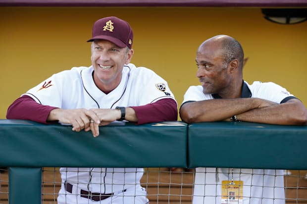 ASU head coach Tracy Smith talks with Athletic Director Ray Anderson (right) before playing Oklahoma State. 