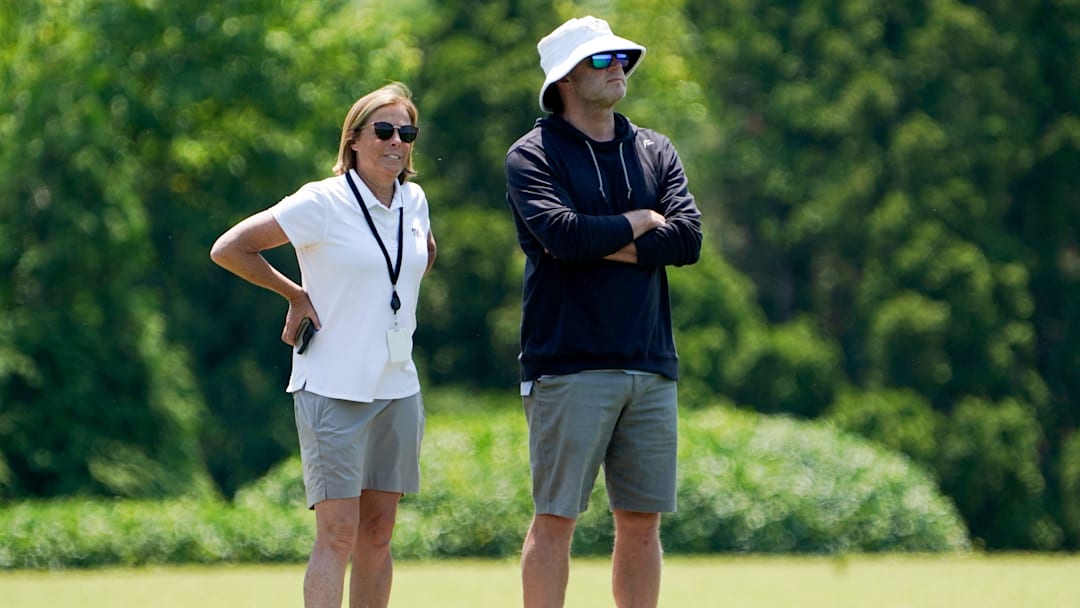Katie Blackburn, left, and Duke Tobin, right, watch the Cincinnati Bengals practice, Wednesday, June 11, 2025, at Kettering Health Practice Fields in Downtown Cincinnati.