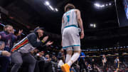 Jan 17, 2024; New Orleans, Louisiana, USA; New Orleans Pelicans fan laughs at Charlotte Hornets guard LaMelo Ball (1) as he looses the ball out of bounds during the second half at Smoothie King Center. Mandatory Credit: Stephen Lew-USA TODAY Sports