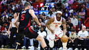Apr 2, 2024; Miami, Florida, USA; New York Knicks forward Precious Achiuwa (5) drives to the basket against Miami Heat forward Nikola Jovic (5) during the first quarter at Kaseya Center. Mandatory Credit: Sam Navarro-Imagn Images