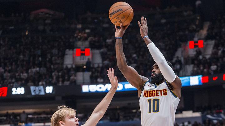 Oct 6, 2025; Vancouver, British Columbia, CAN; Denver Nuggets guard Tim Hardaway Jr (10) shoots over Toronto Raptors forward Gradey Dick (1) in the second half at Rogers Arena. Mandatory Credit: Bob Frid-Imagn Images