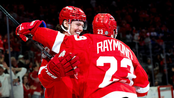 Oct 26, 2023; Detroit, Michigan, USA;  Detroit Red Wings left wing Lucas Raymond (23) receives congratulations from defenseman Moritz Seider (53) after scoring in the second period against the Winnipeg Jets at Little Caesars Arena. Mandatory Credit: Rick Osentoski-Imagn Images