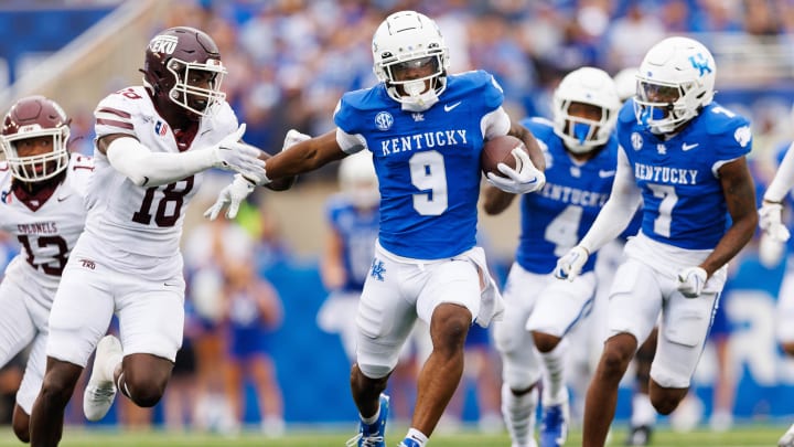 Sep 9, 2023; Lexington, Kentucky, USA; Kentucky Wildcats wide receiver Tayvion Robinson (9) runs down the field against Eastern Kentucky Colonels linebacker Cornelius Evans (18) during the third quarter at Kroger Field. Mandatory Credit: Jordan Prather-USA TODAY Sports