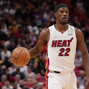 Mar 23, 2022; Miami, Florida, USA; Miami Heat forward Jimmy Butler (22) dribbles the ball up the court against the Golden State Warriors during the first half at FTX Arena. Mandatory Credit: Jasen Vinlove-Imagn Images