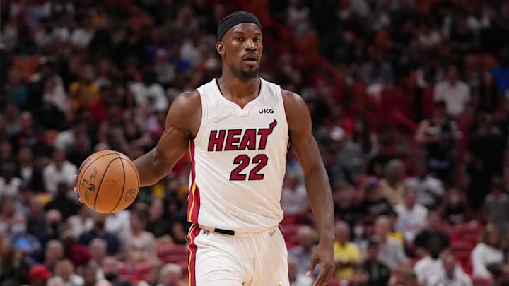 Mar 23, 2022; Miami, Florida, USA; Miami Heat forward Jimmy Butler (22) dribbles the ball up the court against the Golden State Warriors during the first half at FTX Arena. Mandatory Credit: Jasen Vinlove-Imagn Images