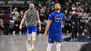 Feb 12, 2025; Dallas, Texas, USA; Dallas Mavericks guard Klay Thompson (left) and Golden State Warriors guard Stephen Curry (right) warm up before the game at the American Airlines Center. Mandatory Credit: Jerome Miron-Imagn Images