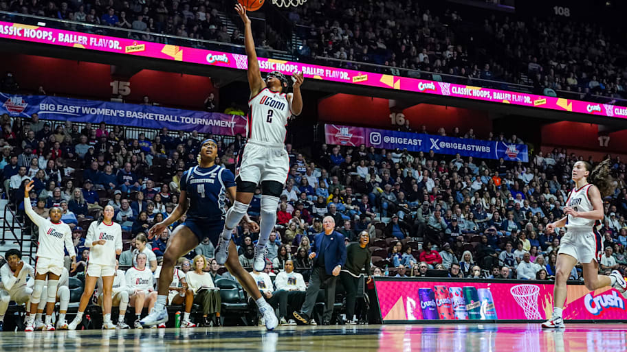 UConn Huskies guard Kk Arnold (2) makes the basket against Georgetown Hoyas