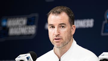 Mar 21, 2024; Indianapolis, IN, USA; Utah State Aggies head coach Danny Sprinkle talks to the media during the practice day at Gainbridge FieldHouse. Mandatory Credit: Trevor Ruszkowski-Imagn Images