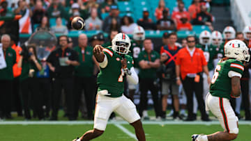 Nov 23, 2024; Miami Gardens, Florida, USA; Miami Hurricanes quarterback Cam Ward (1) throws the football against the Wake Forest Demon Deacons during the first quarter at Hard Rock Stadium. Mandatory Credit: Sam Navarro-Imagn Images