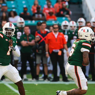 Nov 23, 2024; Miami Gardens, Florida, USA; Miami Hurricanes quarterback Cam Ward (1) throws the football against the Wake Forest Demon Deacons during the first quarter at Hard Rock Stadium. Mandatory Credit: Sam Navarro-Imagn Images