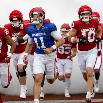 Oklahoma's Jackson Arnold (11) takes the field with teammates before a University of Oklahoma (OU) Sooners spring football game at Gaylord Family-Oklahoma Memorial Stadium in Norman, Okla., Saturday, April 20, 2024.