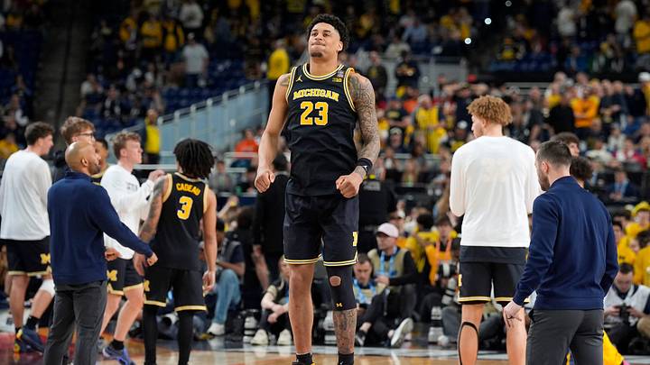Michigan forward Yaxel Lendeborg (23) warms up on the court before the start of the second half of their Final Four game at Lucas Oil Stadium in Indianapolis on Saturday, April 4, 2026.