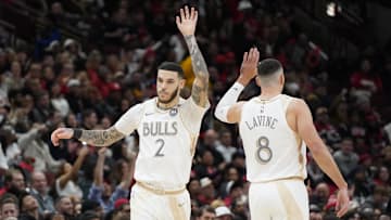 Jan 4, 2025; Chicago, Illinois, USA; Chicago Bulls guard Lonzo Ball (2) high fives guard Zach LaVine (8) after making a three point basket against the New York Knicks during the second half at United Center. Mandatory Credit: David Banks-Imagn Images