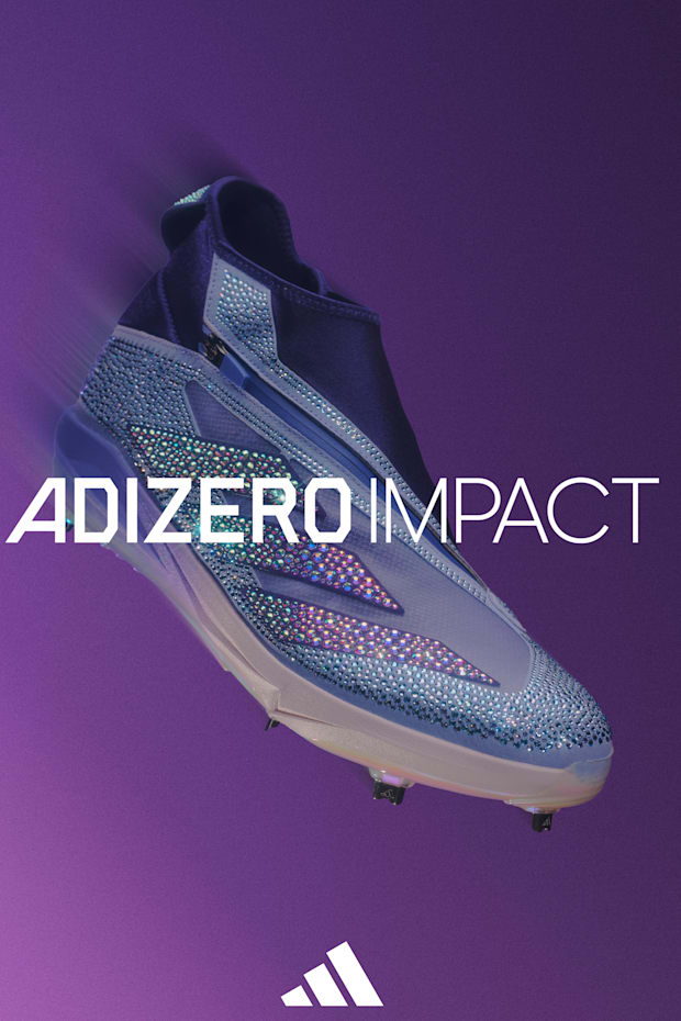 Purple adidas baseball cleats.