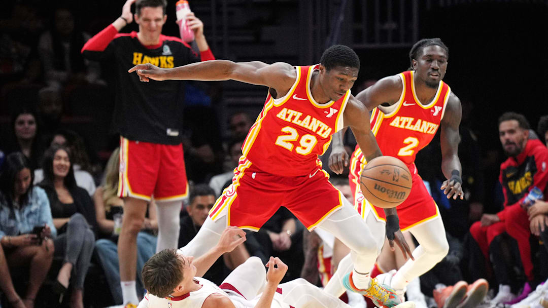 Oct 16, 2024; Miami, Florida, USA; Miami Heat guard Pelle Larsson (9) collides with Atlanta Hawks guard Daeqwon Plowden (29) in the second half at Kaseya Center. Mandatory Credit: Jim Rassol-Imagn Images