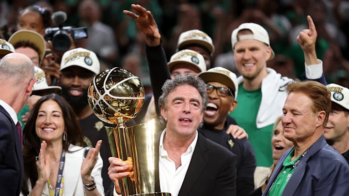 Jun 17, 2024; Boston, Massachusetts, USA; Boston Celtics owner Wyc Grousbeck holds the trophy after winning the 2024 NBA Finals against the Dallas Mavericks at TD Garden. Mandatory Credit: Peter Casey-Imagn Images