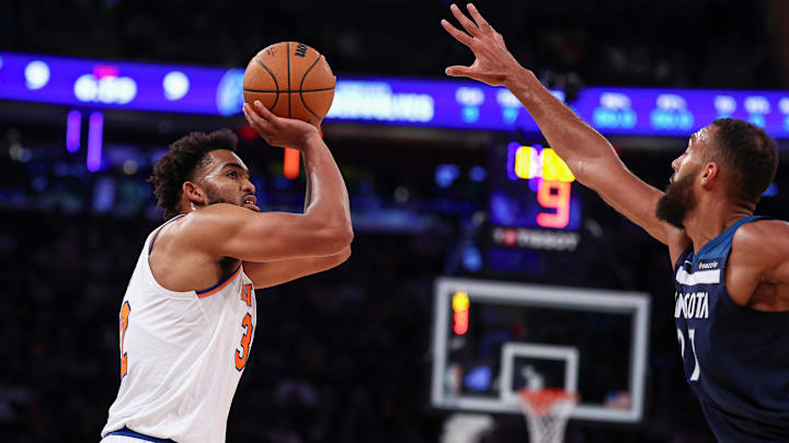 Karl-Anthony Towns shoots over his former teammate Rudy Gobert during a preseason game. Karl-Anthony Towns shoots over his former teammate Rudy Gobert during a preseason game.