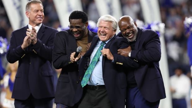 Dallas Cowboys former head coach Jimmy Johnson laughs with former players Troy Aikman and Michael Irvin and Emmitt Smith