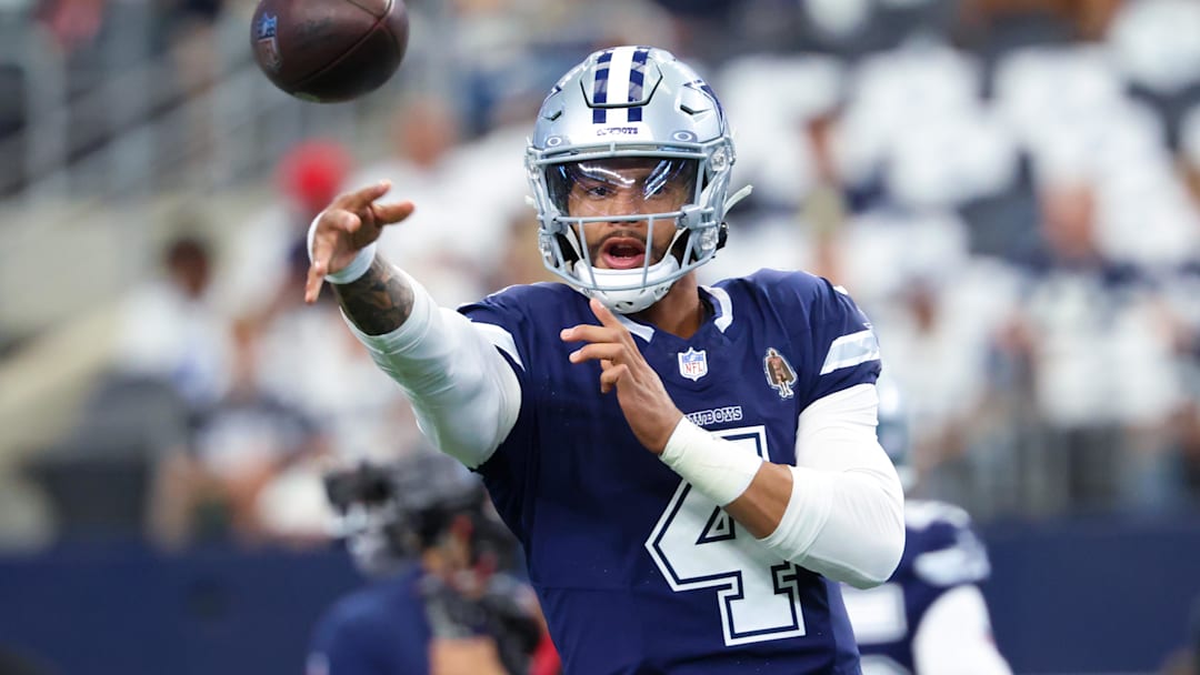 Oct 13, 2024; Arlington, Texas, USA; Dallas Cowboys quarterback Dak Prescott (4) warms up before the game against the Detroit Lions at AT&T Stadium. Mandatory Credit: Kevin Jairaj-Imagn Images