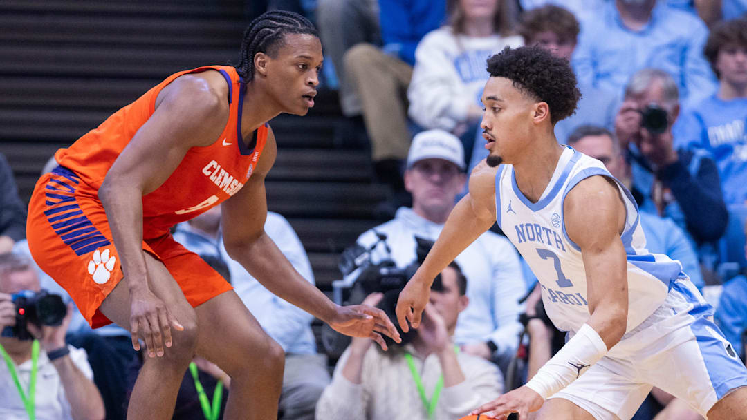 Mar 3, 2026; Chapel Hill, North Carolina, USA; North Carolina Tar Heels guard Seth Trimble (7) drives to the basket against Clemson Tigers forward RJ Godfrey (0) during the first half at Dean E. Smith Center. Mandatory Credit: Scott Kinser-Imagn Images