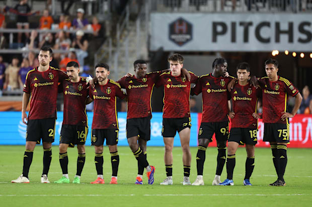 Seattle Sounders players look on during a penalty shootou