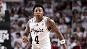 Jan 4, 2025; College Station, Texas, USA; Texas A&M Aggies guard Wade Taylor IV (4) looks on during the first half against the Texas Longhorns at Reed Arena. The Aggies defeated the Longhorns 80-60. Mandatory Credit: Maria Lysaker-Imagn Images 