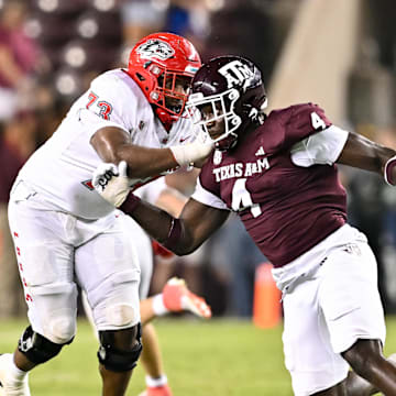 Sep 2, 2023; College Station, Texas, USA; Texas A&M Aggies defensive lineman Shemar Stewart (4) breaks past New Mexico Lobos offensive lineman Matthew Toilolo (74) during the fourth quarter at Kyle Field. Mandatory Credit: Maria Lysaker-Imagn Images