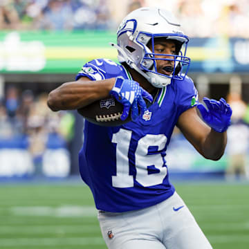 Sep 8, 2024; Seattle, Washington, USA; Seattle Seahawks wide receiver Tyler Lockett (16) runs for yards after the catch against the Denver Broncos during the third quarter at Lumen Field. Mandatory Credit: Joe Nicholson-Imagn Images