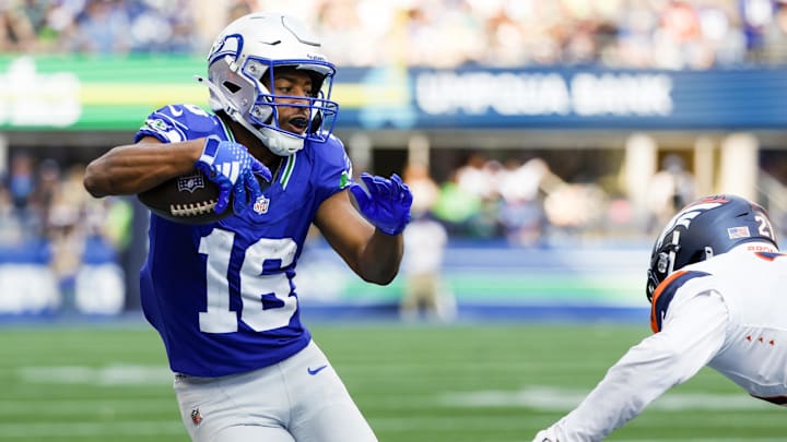 Sep 8, 2024; Seattle, Washington, USA; Seattle Seahawks wide receiver Tyler Lockett (16) runs for yards after the catch against the Denver Broncos during the third quarter at Lumen Field. Mandatory Credit: Joe Nicholson-Imagn Images