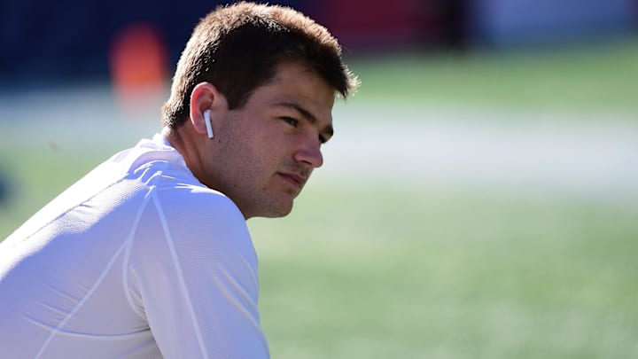 New England Patriots quarterback Drake Maye (10) looks on during warm up prior to the game against the Cleveland Browns at Gillette Stadium.
