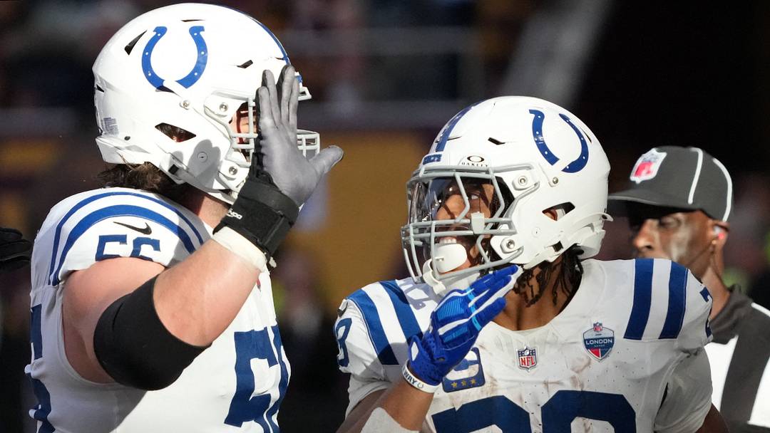 Oct 4, 2026; Tottenham, ENG;  Indianapolis Colts running back Jonathan Taylor (28) celebrates his touchdown against the Washington Commanders with guard Quenton Nelson (56) during the third quarter at Tottenham Hotspur Stadium.  Mandatory Credit: Kirby Lee-Imagn Images