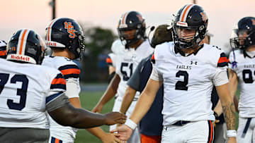Nashville Christian quarterback Jared Curtis (2) is congratulated after playing the first quarter against Franklin Road Academy during an high school football scrimmage Friday, Aug. 16, 2024, in Nashville, Tenn.