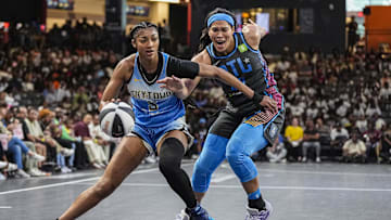 Jun 13, 2025; College Park, Georgia, USA; Chicago Sky forward Angel Reese (5) dribbles against Atlanta Dream forward Brionna Jones (24) during the first half at Gateway Center Arena at College Park. Mandatory Credit: Dale Zanine-Imagn Images