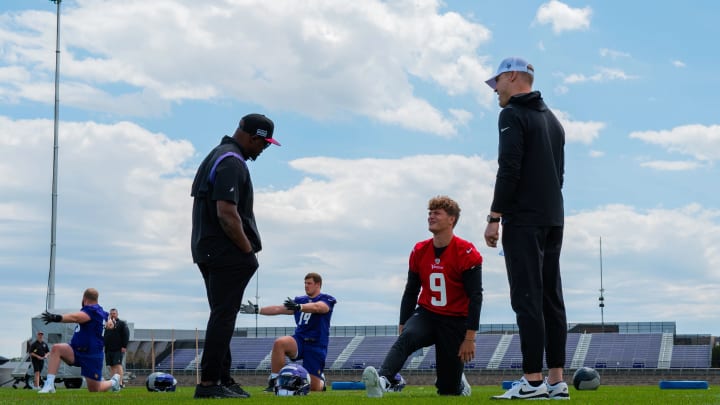 Vikings defensive coordinator Brian Flores, quarterback J.J. McCarthy, and QBs coach Josh McCown.