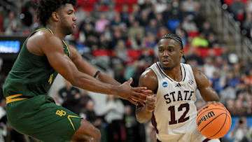 Mar 21, 2025; Raleigh, NC, USA; Baylor Bears forward Norchad Omier (15) defends against Mississippi State Bulldogs guard Josh Hubbard (12) during the first half in the first round of the NCAA Tournament at Lenovo Center. Mandatory Credit: Zachary Taft-Imagn Images