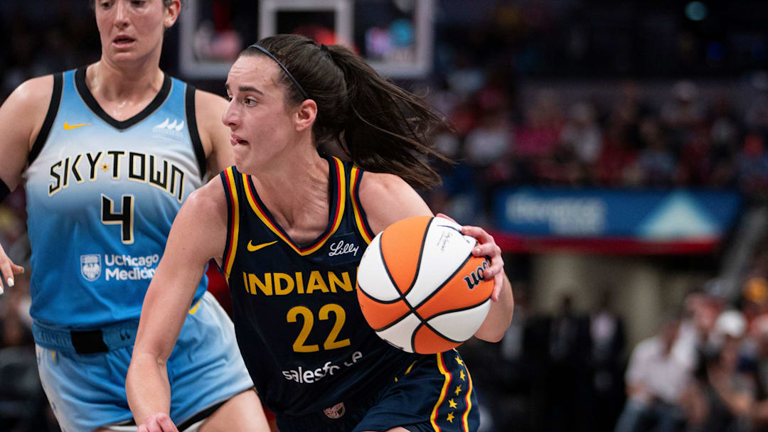 Indiana Fever guard Caitlin Clark (22) dribbles around Chicago Sky guard Marina Mabrey (4) on Sunday June 16, 2024, during the game at Gainbridge Fieldhouse in Indianapolis. The Fever beat the Sky 91-83.