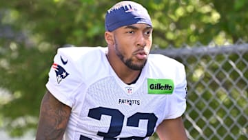 Jul 28, 2025; Foxborough, MA, USA; New England Patriots running back TreVeyon Henderson (32) heads to the practice fields for training camp at Gillette Stadium. Mandatory Credit: Eric Canha-Imagn Images
