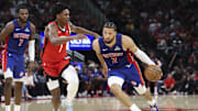 Oct 24, 2025; Houston, Texas, USA; Detroit Pistons guard Cade Cunningham (2) dribbles the ball as Houston Rockets guard Amen Thompson (1) defends during the fourth quarter at Toyota Center. Mandatory Credit: Troy Taormina-Imagn Images