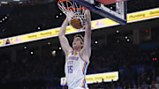 Oct 28, 2025; Oklahoma City, Oklahoma, USA; Oklahoma City Thunder center Branden Carlson (15) dunks against the Sacramento Kings during the second half at Paycom Center. Mandatory Credit: Alonzo Adams-Imagn Images