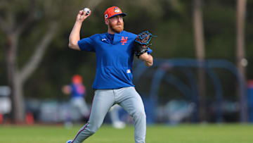 Feb 15, 2025; Port St. Lucie, FL, USA; New York Mets pitcher Reed Garrett (75) plays catch during a spring training workout at Clover Park. Mandatory Credit: Sam Navarro-Imagn Images
