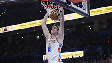 Oct 28, 2025; Oklahoma City, Oklahoma, USA; Oklahoma City Thunder center Branden Carlson (15) dunks against the Sacramento Kings during the second half at Paycom Center. Mandatory Credit: Alonzo Adams-Imagn Images