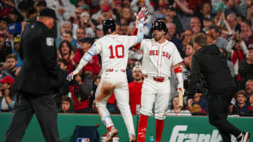 Jun 10, 2025; Boston, Massachusetts, USA; Boston Red Sox shortstop Trevor Story (10) is congratulated by third base Marcelo Mayer (39) after hitting a home run against the Tampa Bay Rays in the sixth inning at Fenway Park. Mandatory Credit: David Butler II-Imagn Images