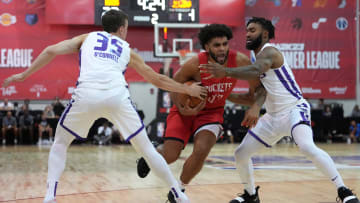 Jul 16, 2022; Las Vegas, NV, USA; Houston Rockets forward Anthony Lamb (33) drives between Sacramento Kings guard Alex O'Connell (35) and Sacramento Kings guard TJ Starks (20) during an NBA Summer League game at Cox Pavillion. Mandatory Credit: Stephen R. Sylvanie-USA TODAY Sports