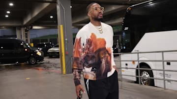 Oct 24, 2025; Portland, Oregon, USA: Portland Trail Blazers guard Damian Lillard (0) makes his way Into Moda Center before Trail Blazers play against the Golden State Warriors. Mandatory Credit: Jaime Valdez-Imagn Images