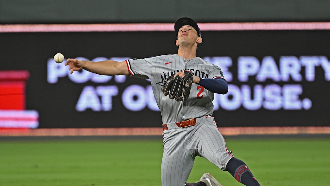 Sep 5, 2025; Kansas City, Missouri, USA;  Minnesota Twins shortstop Brooks Lee (2) throws to first base in the eighth inning against the Kansas City Royals at Kauffman Stadium. Mandatory Credit: Peter Aiken-Imagn Images