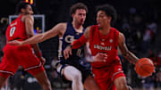 Feb 1, 2025; Atlanta, Georgia, USA; Louisville Cardinals guard Terrence Edwards Jr. (5) drives on Georgia Tech Yellow Jackets guard Lance Terry (0) in the first half at McCamish Pavilion. Mandatory Credit: Brett Davis-Imagn Images