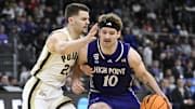 Mar 20, 2025; Providence, RI, USA; High Point Panthers forward Simon Hildebrandt (10) dribbles the ball against Purdue Boilermakers forward Camden Heide (23) during the first half at Amica Mutual Pavilion. Mandatory Credit: Eric Canha-Imagn Images