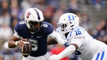 Sep 23, 2023; East Hartford, Connecticut, USA; UConn Huskies quarterback Ta'Quan Roberson (6) is sacked by Duke Blue Devils defensive tackle Aeneas Peebles (16) in the second quarter at Rentschler Field at Pratt & Whitney Stadium. Mandatory Credit: David Butler II-USA TODAY Sports
